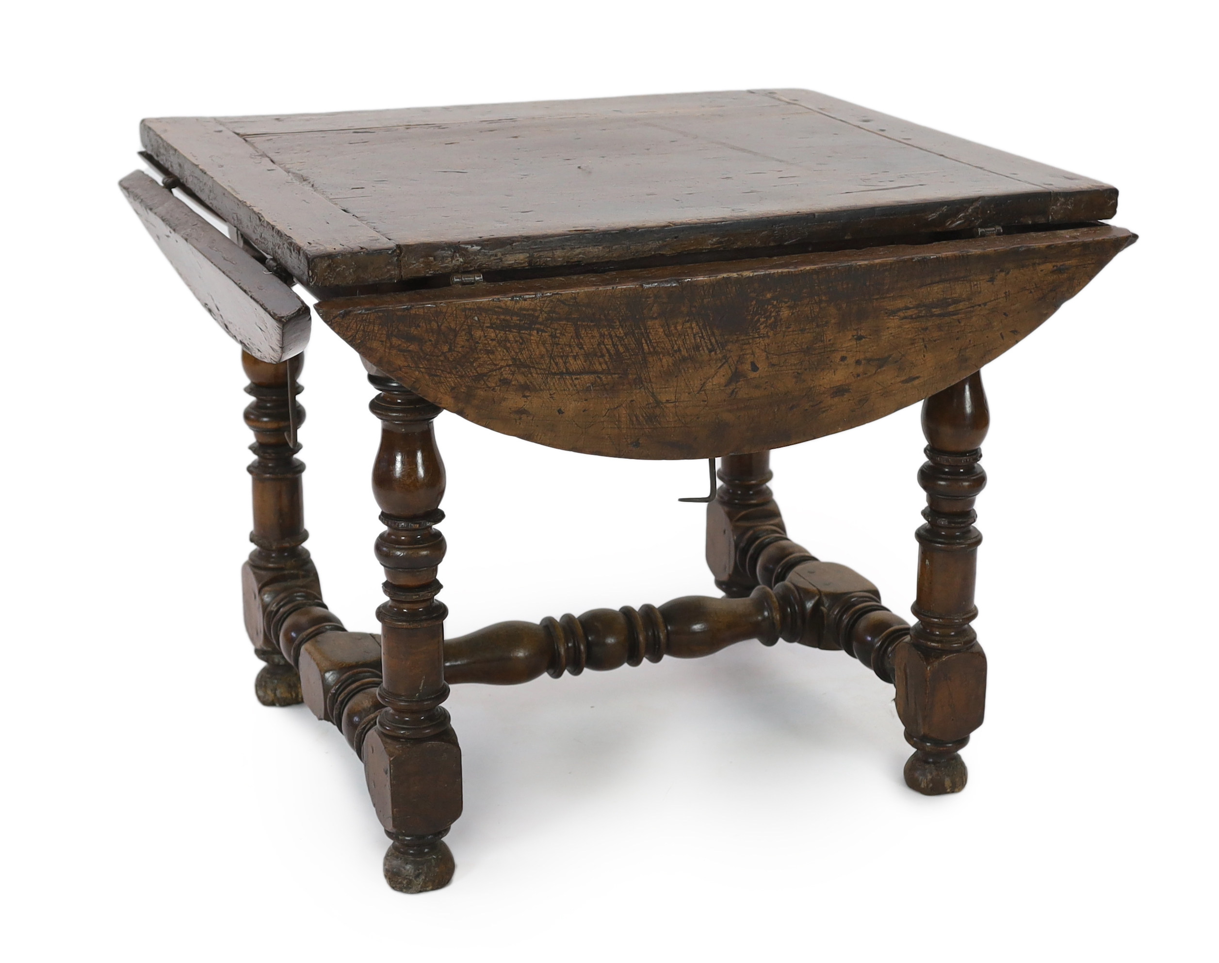 A late 17th century Spanish walnut dining table, 100 x 83cm with flaps down